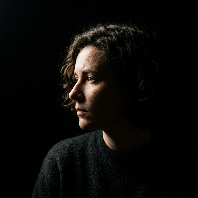 Cameo Lighting — subject intensely lit against total crushed blackness, complete psychological isolation